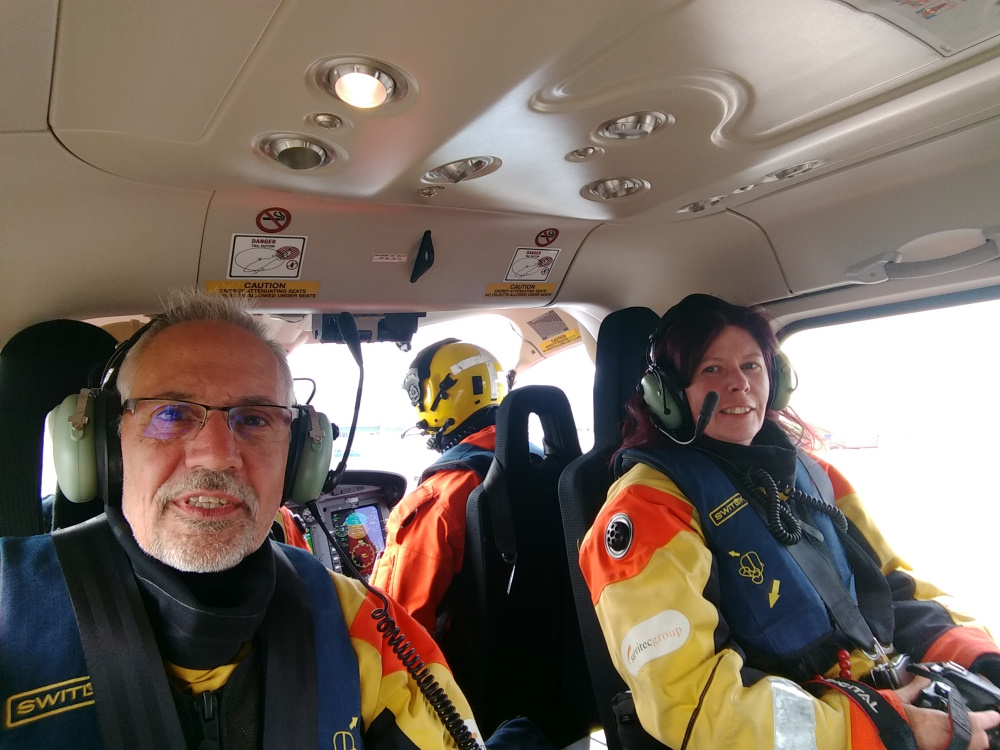 Graham and Sabena being transported to the CCGS Amundsen by helicopter